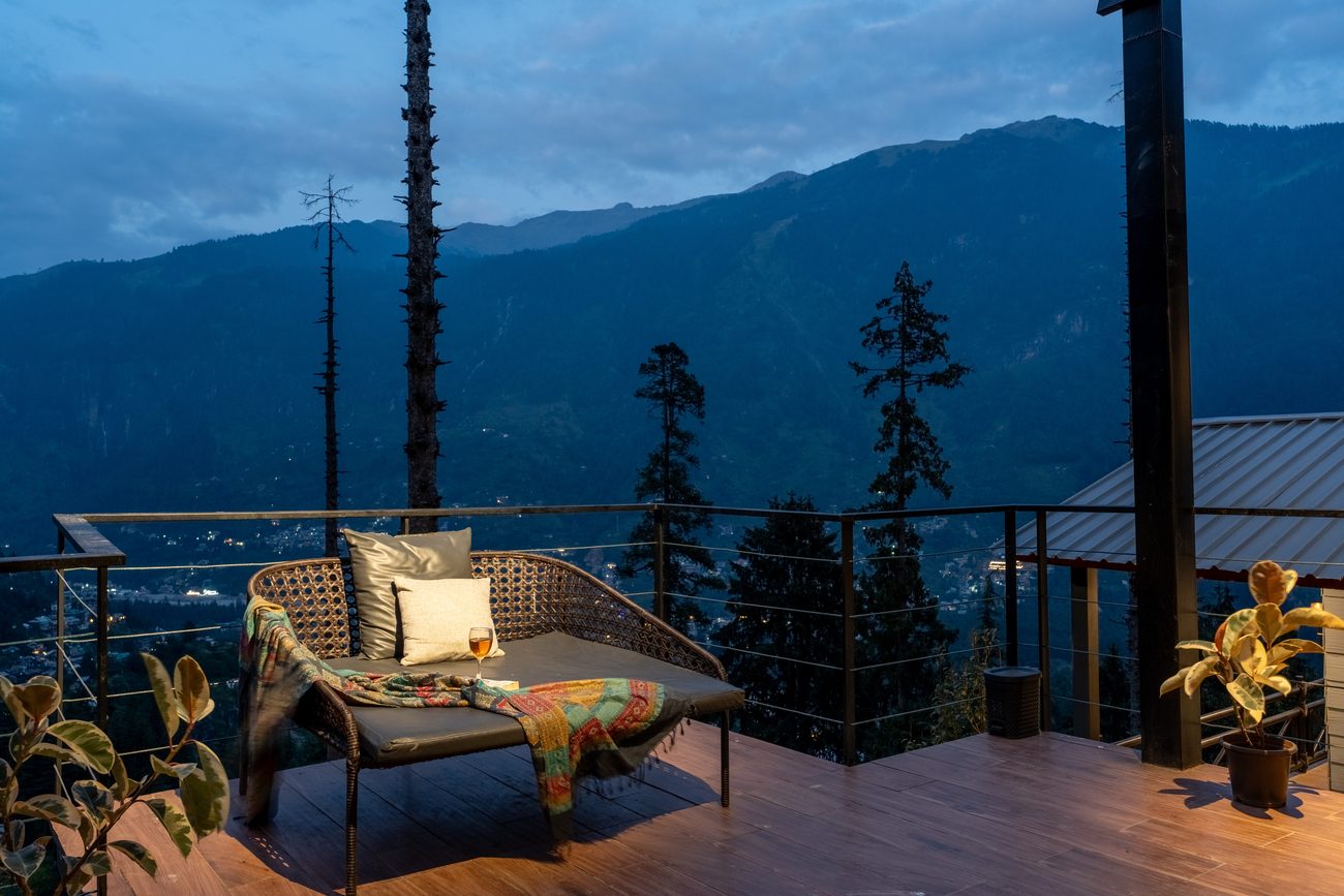 A lounge seat on the deck at blue hour.